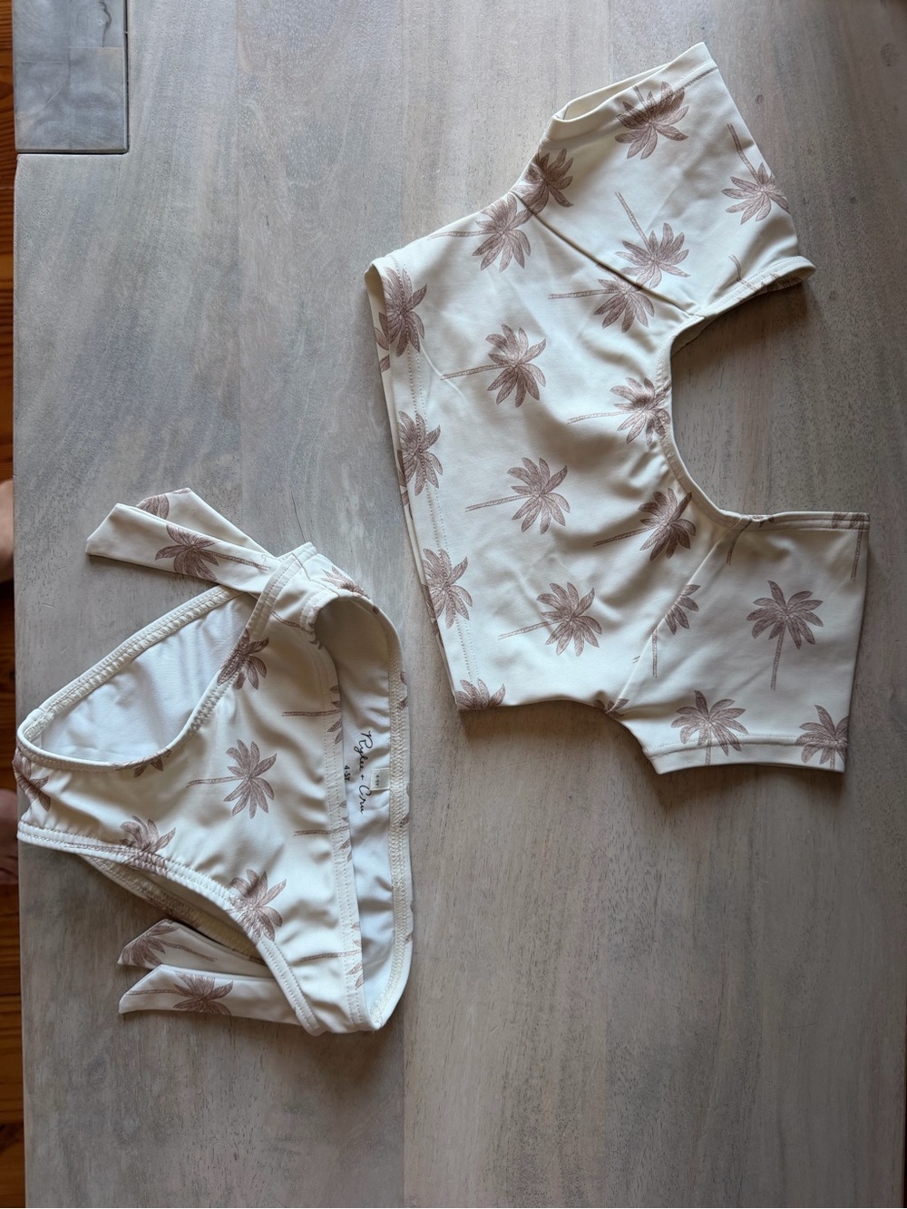 Rylee + Cru cropped rash guard set in cream with Light Brown Palm, worn 3 times